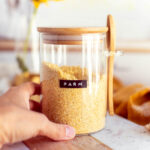 A container of homemade vegan parmesan cheese.