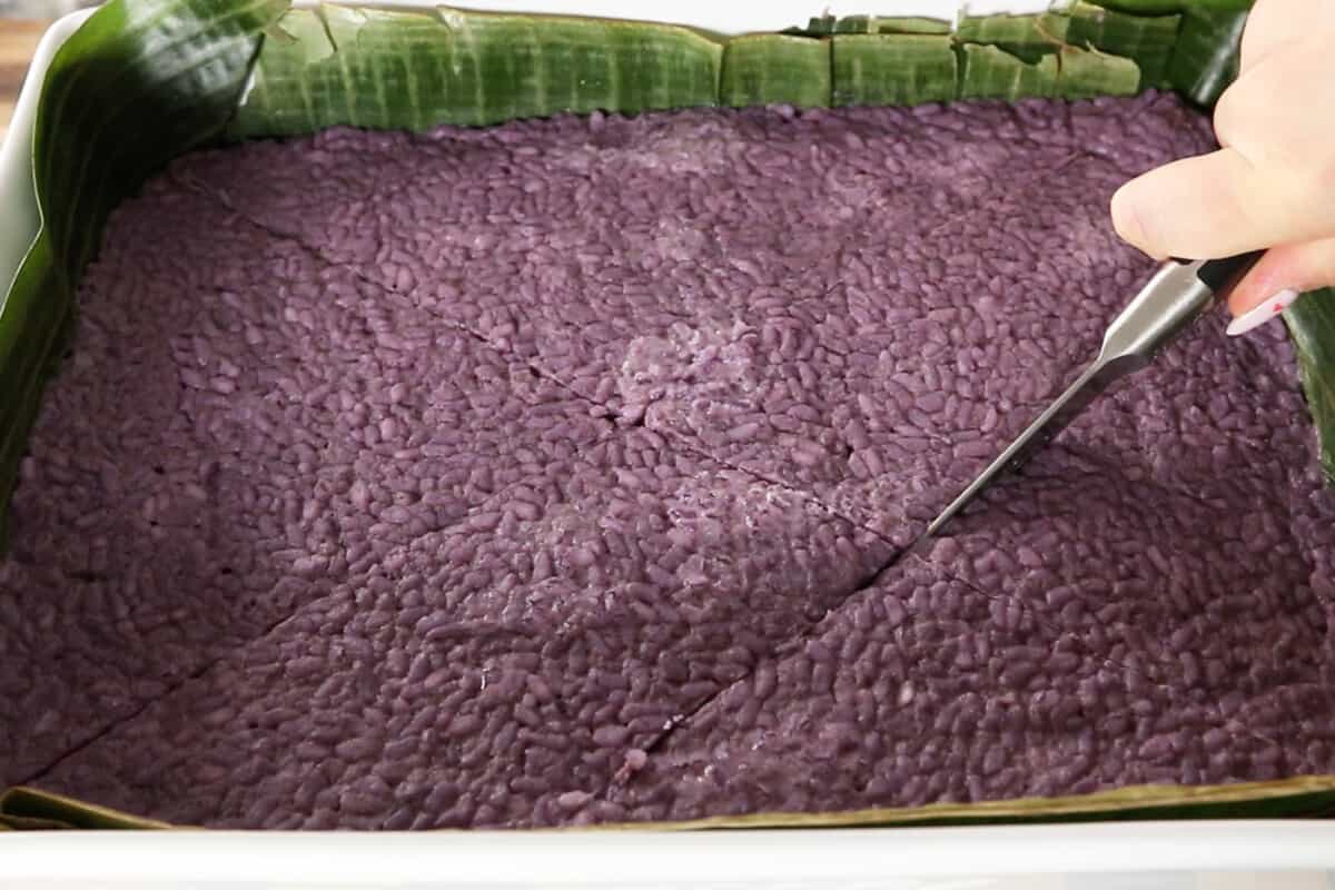 step by step: slicing ube biko in tray