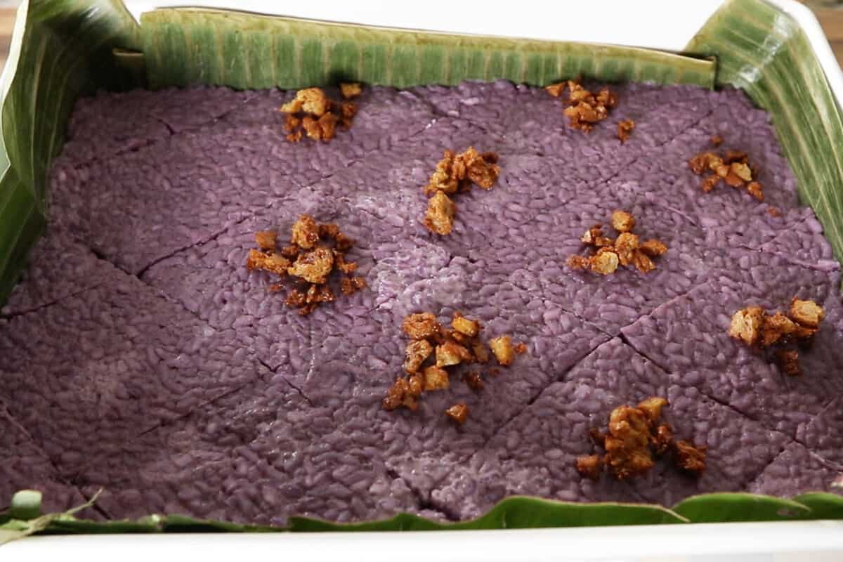 step by step: adding latik to the ube biko